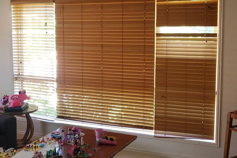Timber venetian blinds across a lounge-room window in McDowall — one of our own jobs