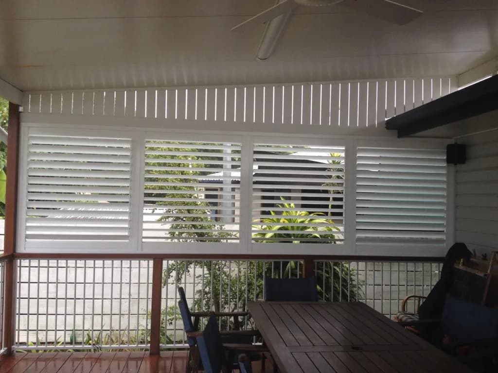 Aluminium shutters enclosing a covered patio — one of our own jobs