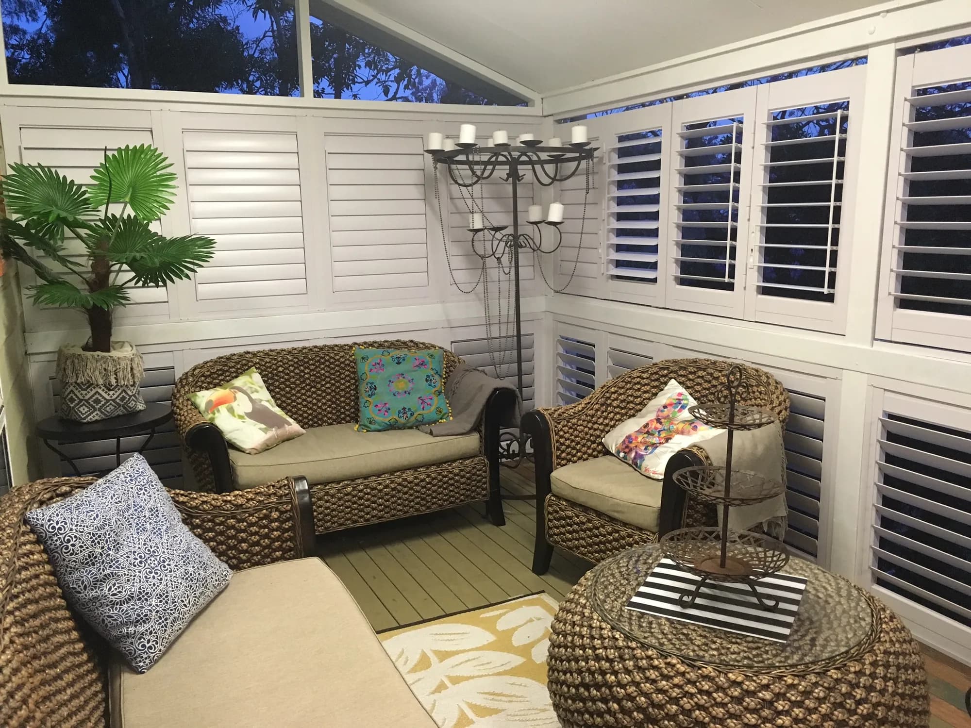 Aluminium shutters on every side of a sunroom — one of our own jobs