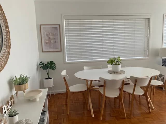 A white venetian blind on a dining-room window — one of our own jobs